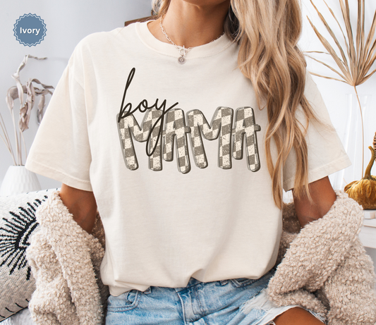 Woman wearing an ivory comfort colors t-shirt with retro checkered 'BOY MAMA' text.