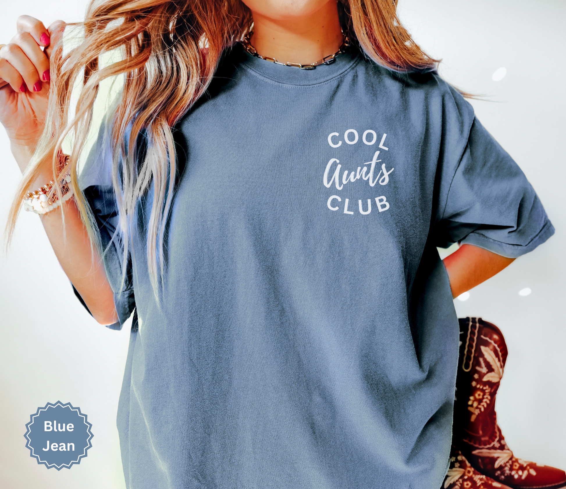 Comfort colors blue jean colored t-shirt with 'Cool Aunts Club' text on pocket.