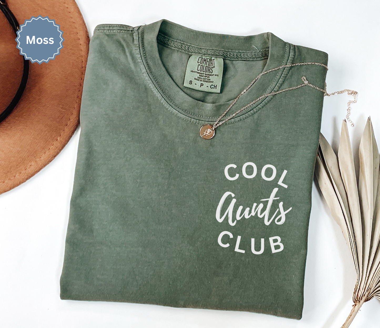 Comfort colors moss green t-shirt with 'Cool Aunts Club' text on pocket.