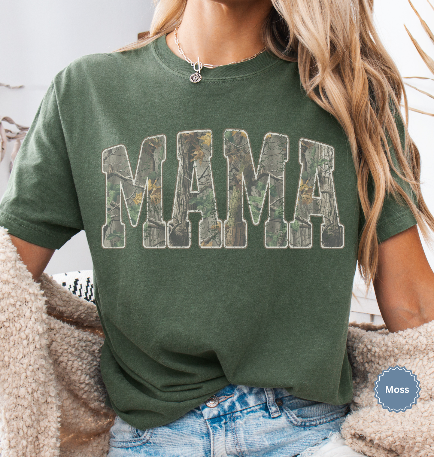 Comfort colors moss green t-shirt with distressed 'MAMA' in camo print text.