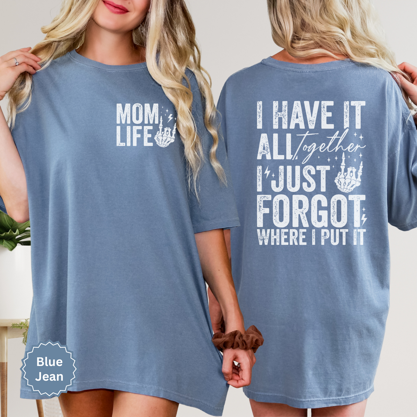 Woman wearing a blue jean colored comfort colors t-shirt with 'Mom Life' of the front pocket and 'I Have It All Together I just forgot where I put it' text on the back.
