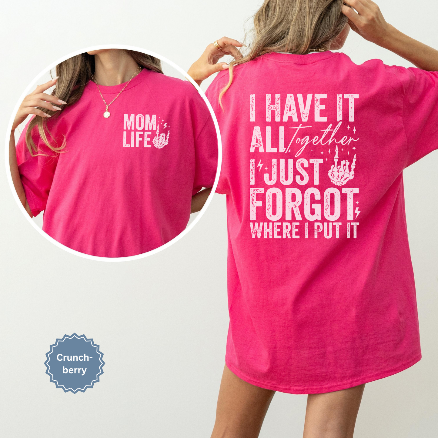 Woman wearing a bright pink crunchberry comfort colors t-shirt with 'Mom Life' of the front pocket and 'I Have It All Together I just forgot where I put it' text on the back.