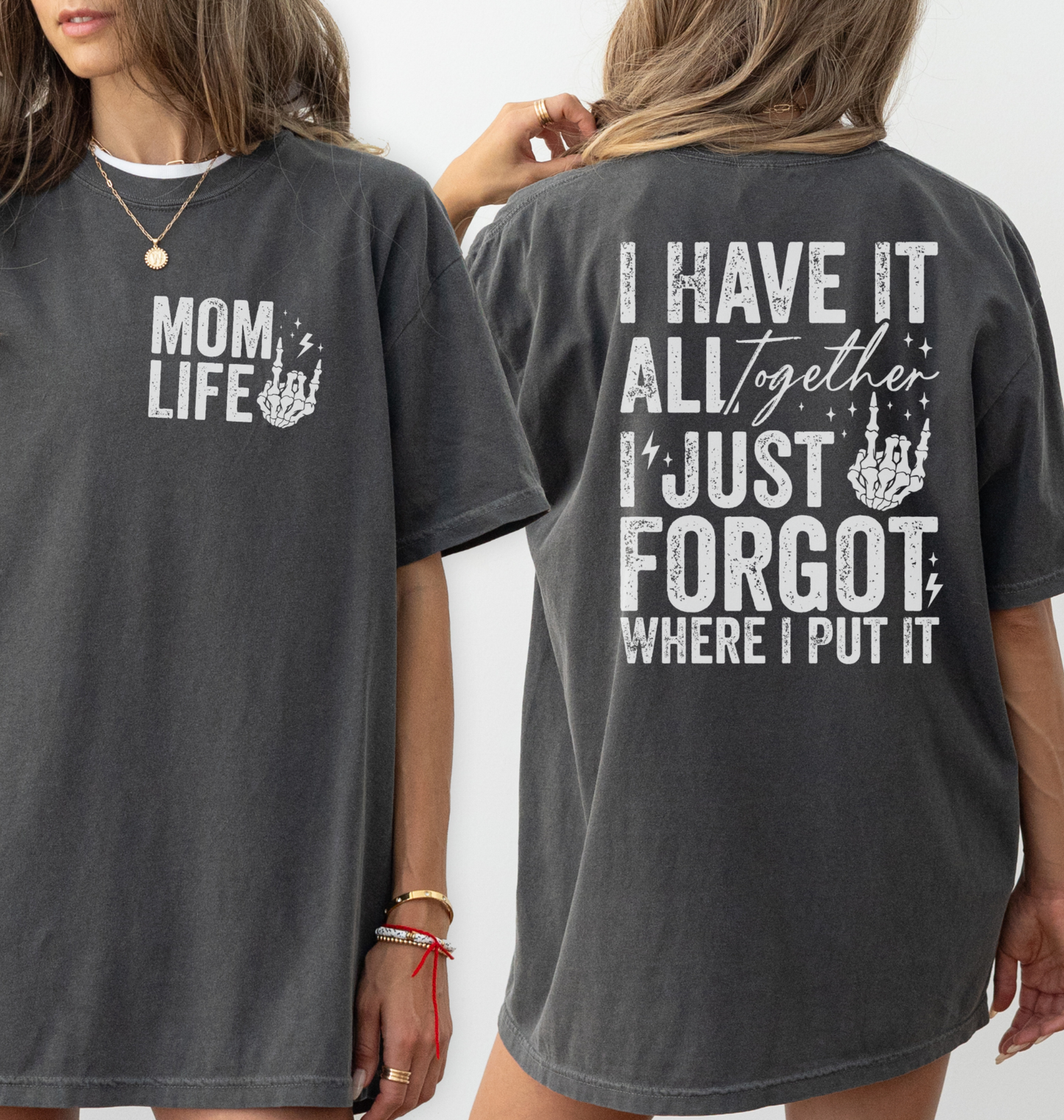 Woman wearing a dark gray pepper comfort colors t-shirt with 'Mom Life' of the front pocket and 'I Have It All Together I just forgot where I put it' text on the back.