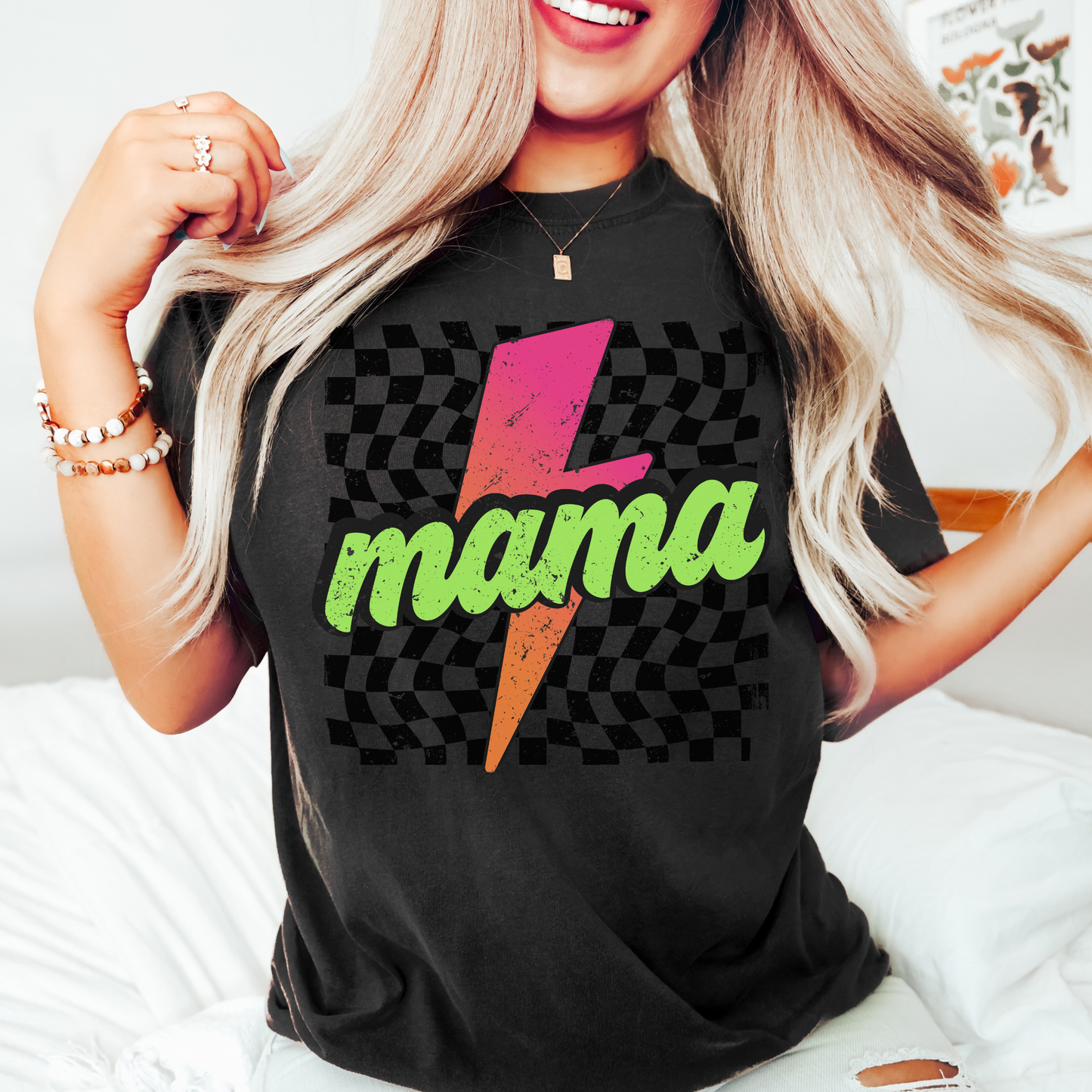 Comfort colors black shirt with colorful neon retro checkered pattern and lightning bolt graphics with "MAMA" text.