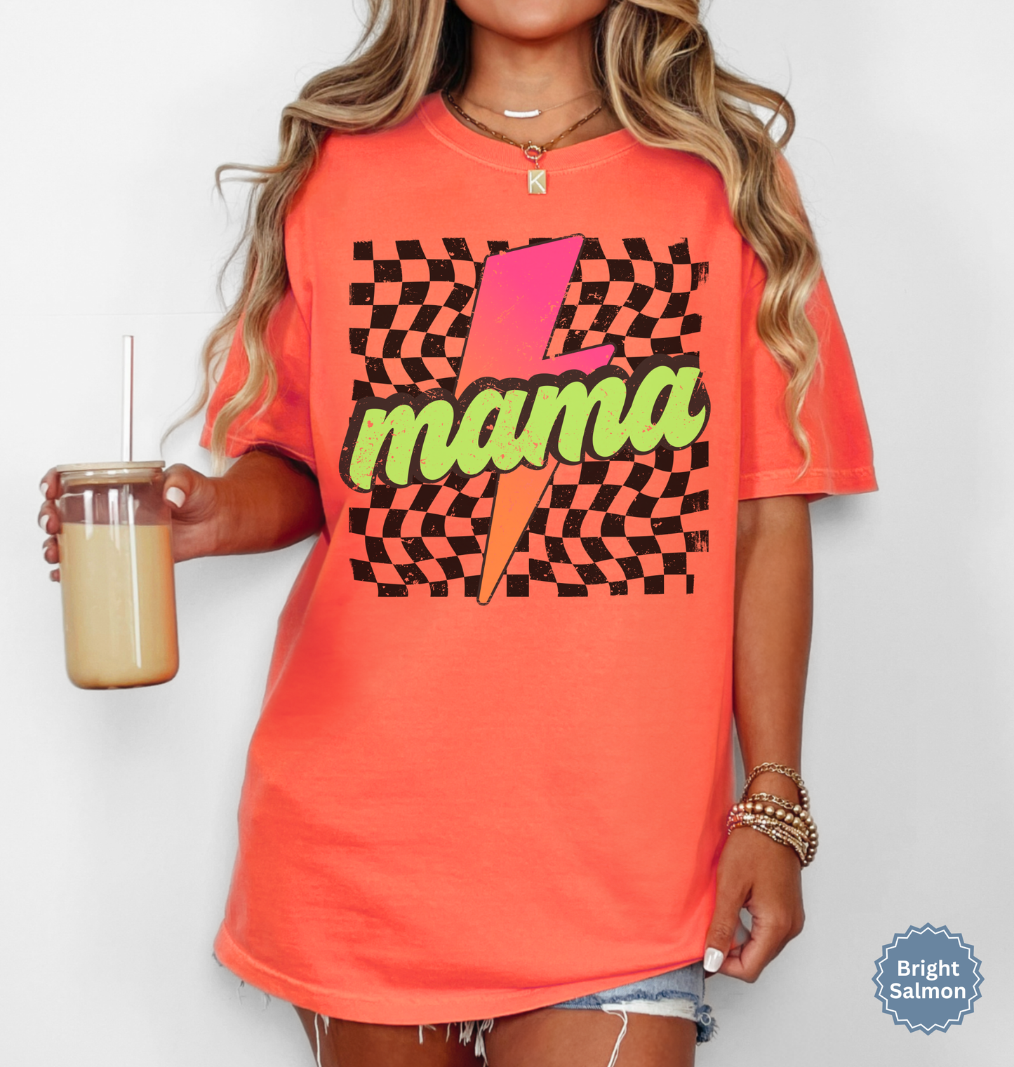 Comfort colors bright salmon shirt with colorful neon retro checkered pattern and lightning bolt graphics with "MAMA" text.