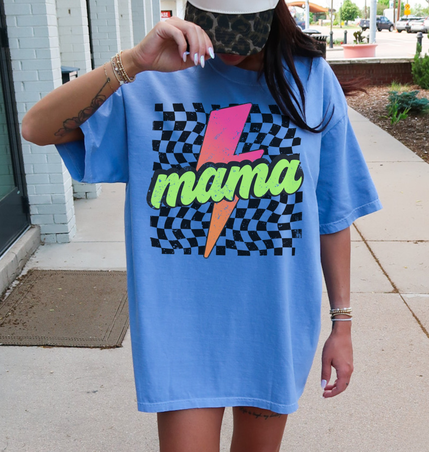 Comfort colors flo blue shirt with colorful neon retro checkered pattern and lightning bolt graphics with "MAMA" text.
