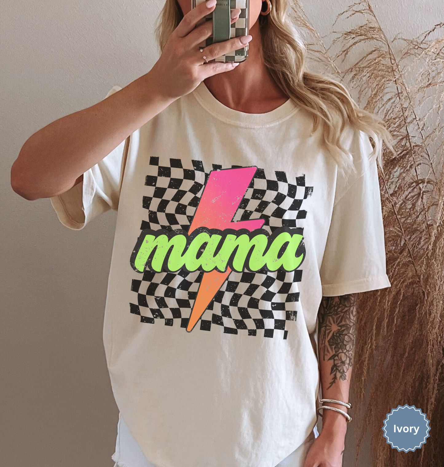 Comfort colors ivory shirt with colorful neon retro checkered pattern and lightning bolt graphics with "MAMA" text.