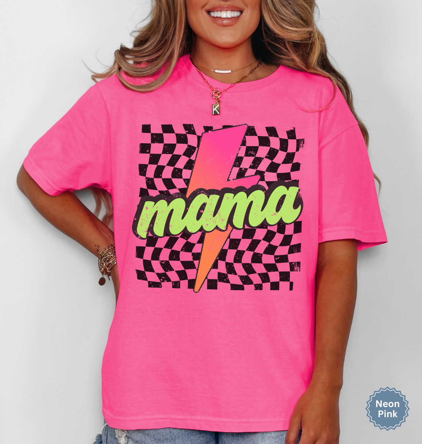 Comfort colors neon pink shirt with colorful neon retro checkered pattern and lightning bolt graphics with "MAMA" text.