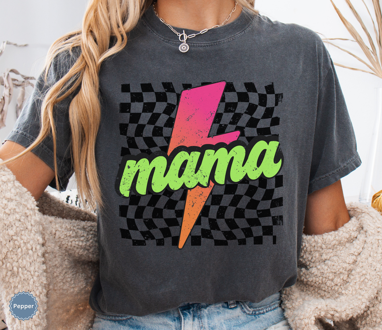 Comfort colors pepper shirt with colorful neon retro checkered pattern and lightning bolt graphics with "MAMA" text.