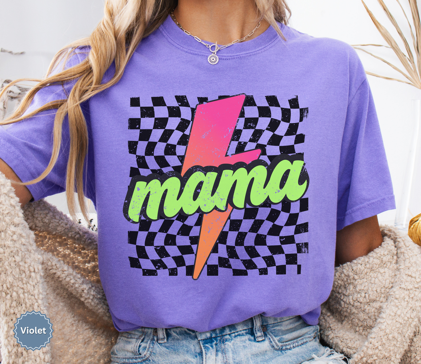 Comfort colors violet shirt with colorful neon retro checkered pattern and lightning bolt graphics with "MAMA" text.