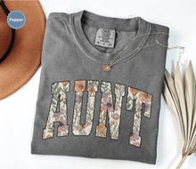 Load image into Gallery viewer, Comfort colors dark grey pepper t-shirt with floral 'AUNT' varsity text
