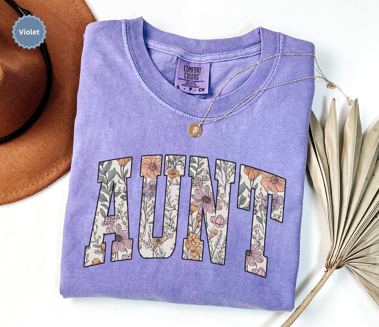 Comfort colors violet purple t-shirt with floral 'AUNT' varsity text